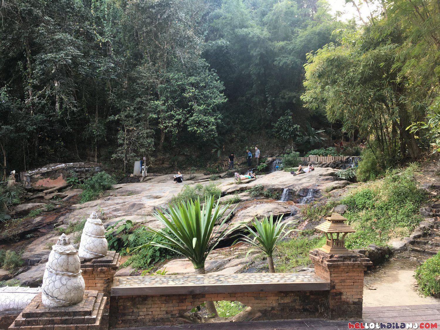 water flowing over mountain rocks Wat Palad Chiang Mai